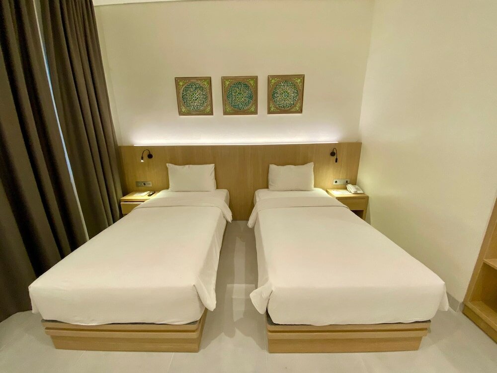 Фото Opi Indah Hotel