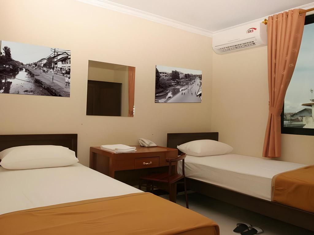 Фото Hotel Aroma Inn Pontianak