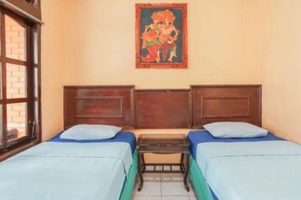 Фото Taman Mekar Beach Inn 2