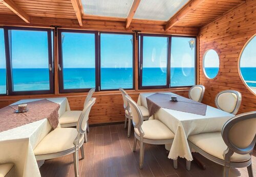 Гостиница Liv Mackenzie Beach Suites в Ларнаке