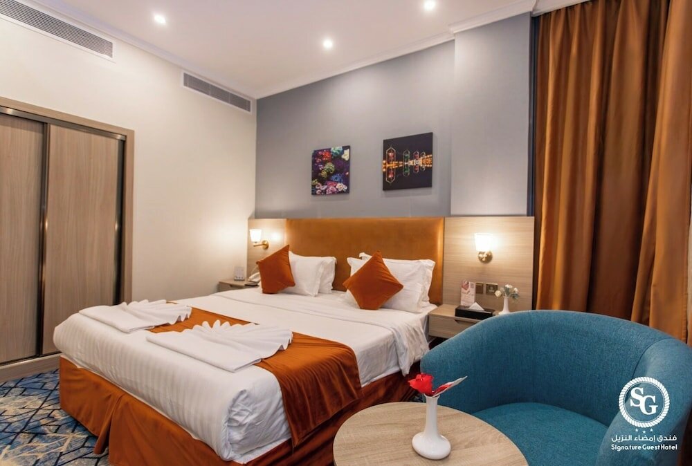 Фото Signature Guest Hotel