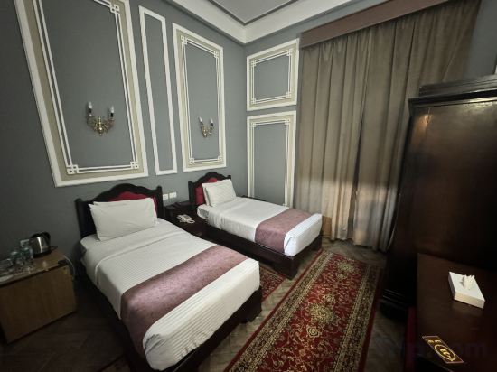 Фото Cosmopolitan Plaza Inn Hotel