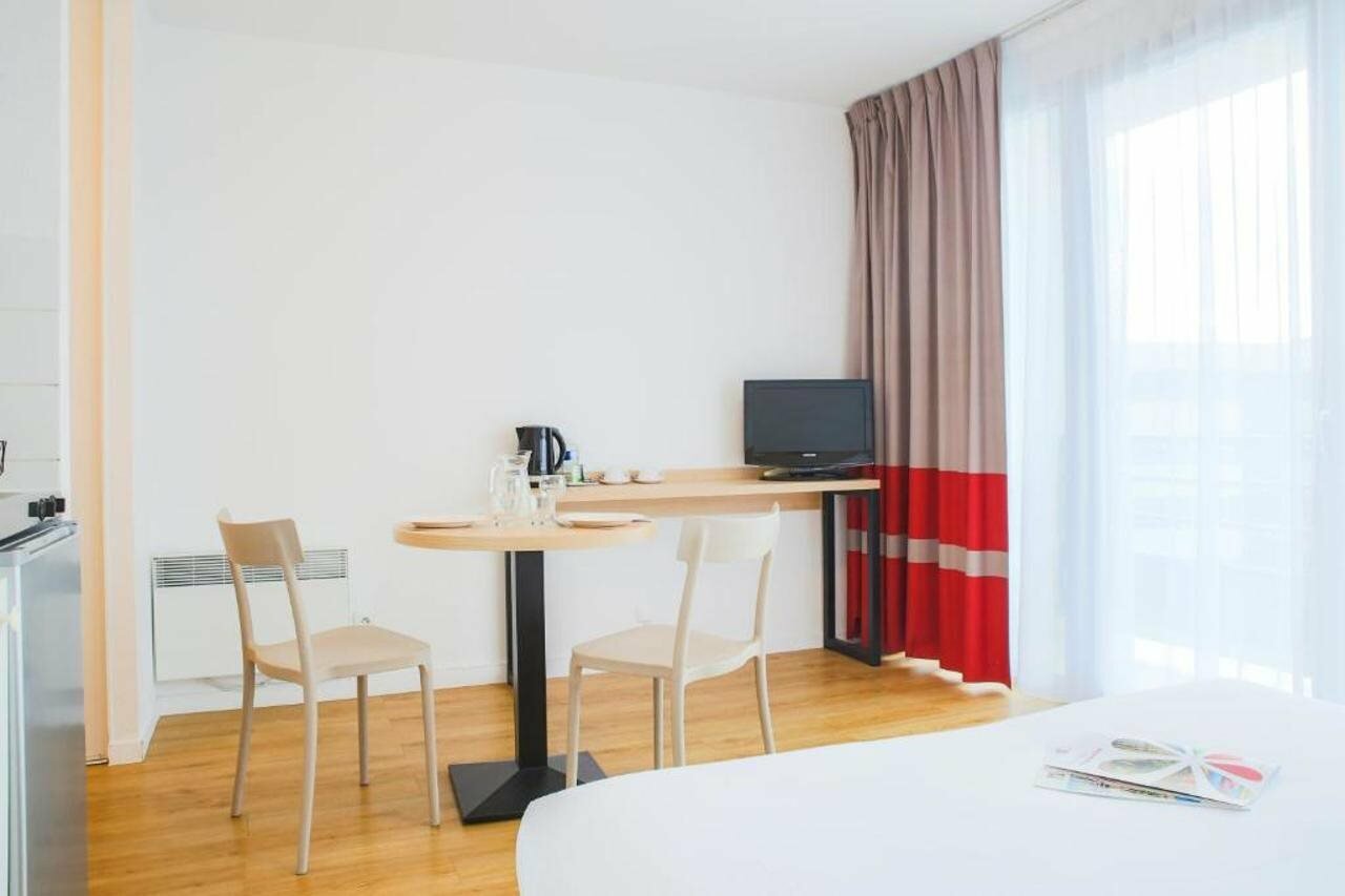 Фото Zenitude Hôtel-Résidences Le Mans Novaxis