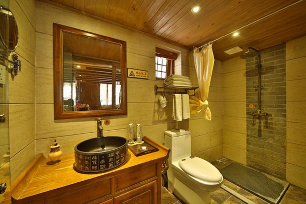 Фото Li Jiang Hemuju Inn