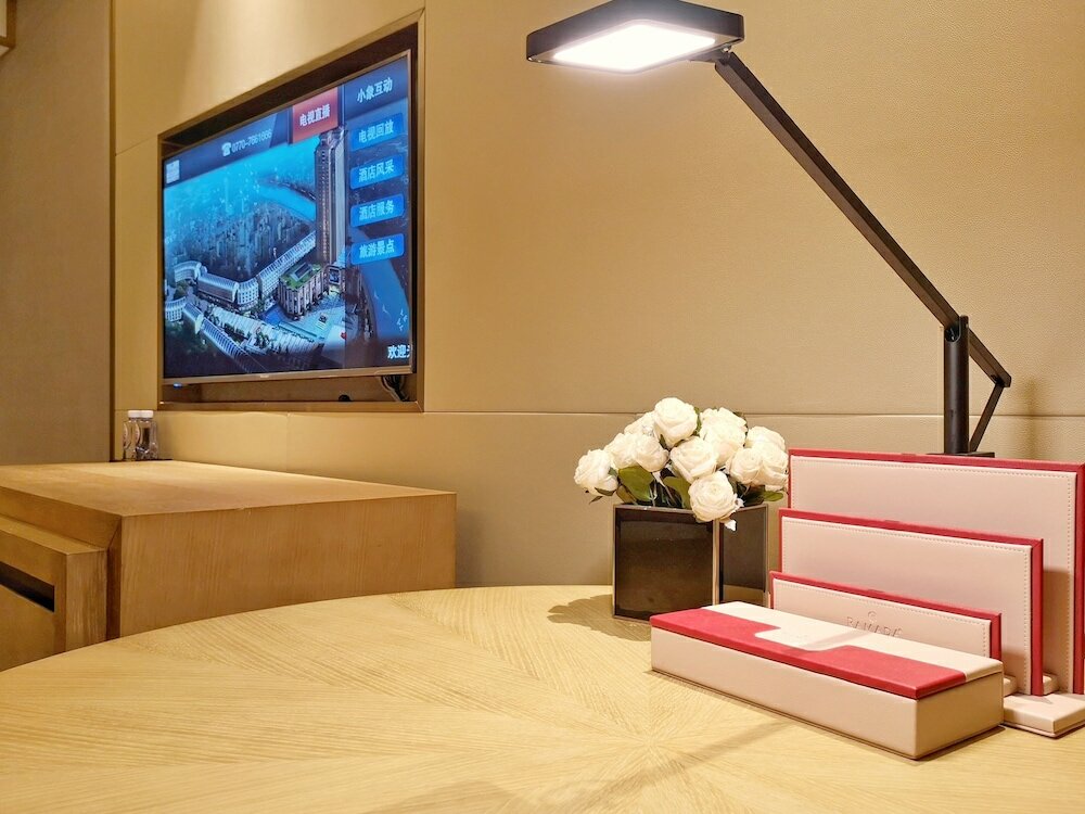 Фото Ramada Plaza Dongxing City Center