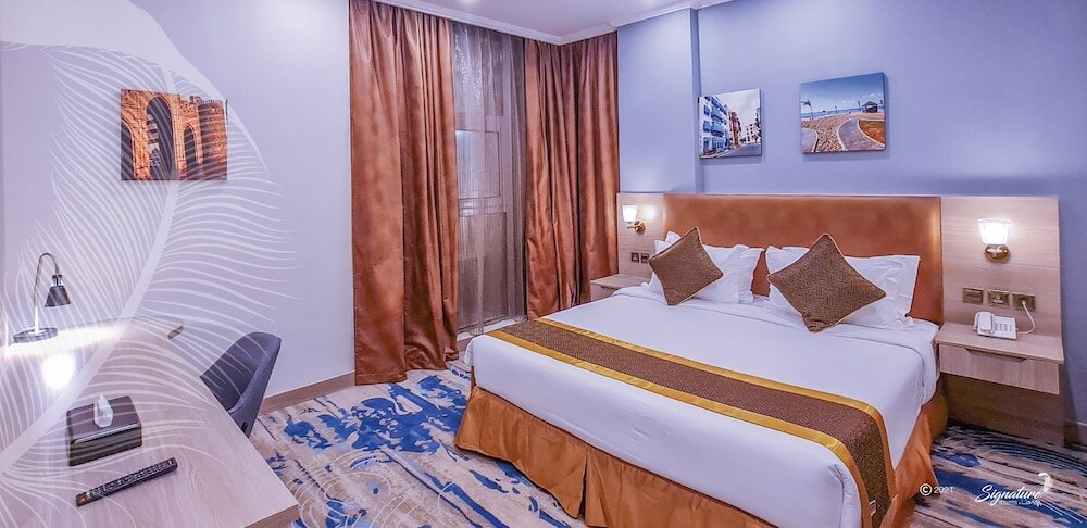 Фото Signature Guest Hotel