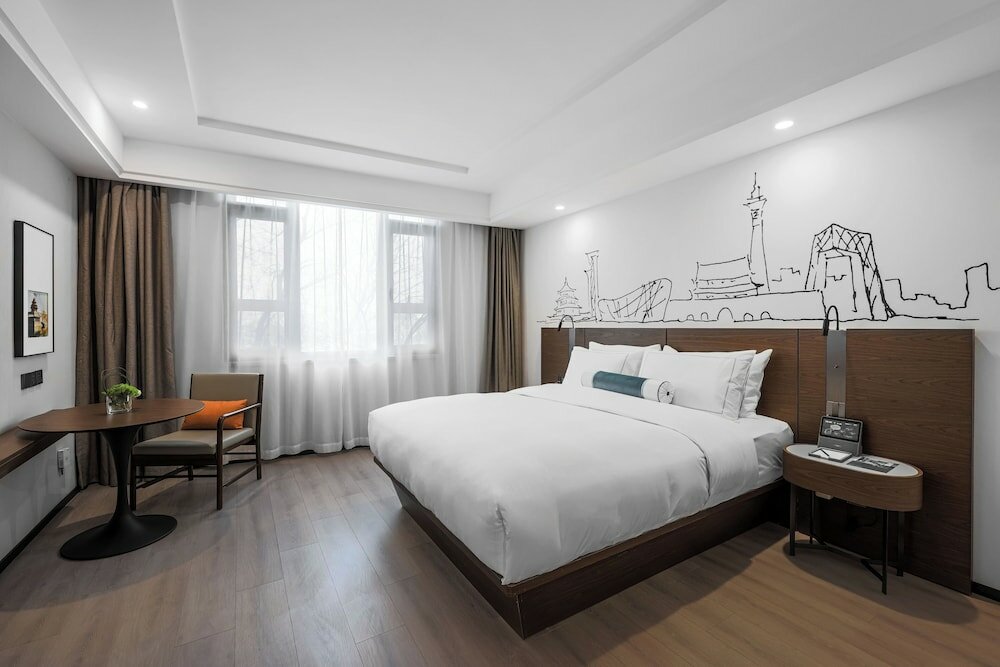 Фото Tianan Rega Hotel Beijing