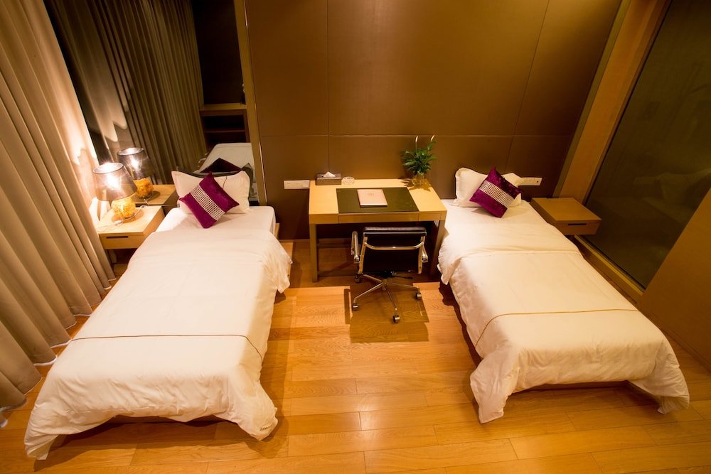 Фото Xingyi International Hotel Poly Store