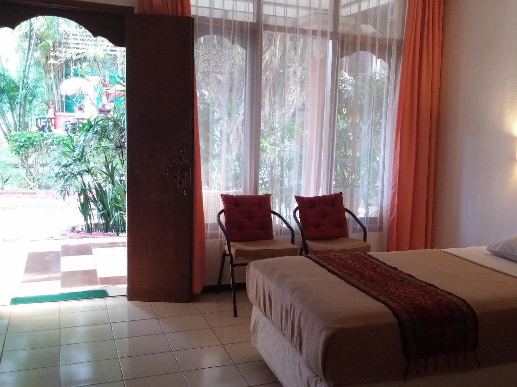 Фото Puri Naga Beachfront Cottages