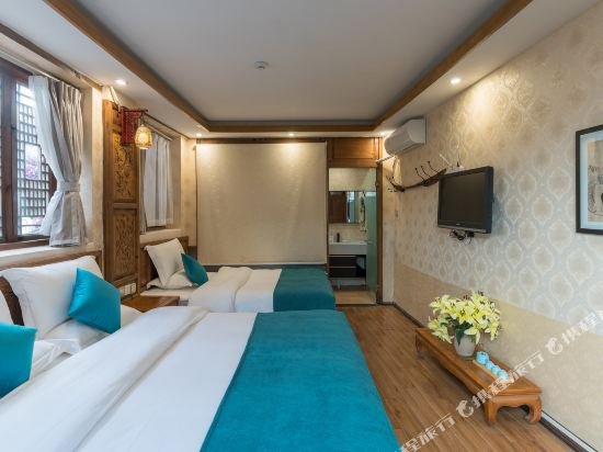 Фото Li Jiang Hemuju Inn