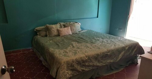 Гостиница Guacamayos Backpackers в Ла-Сейба