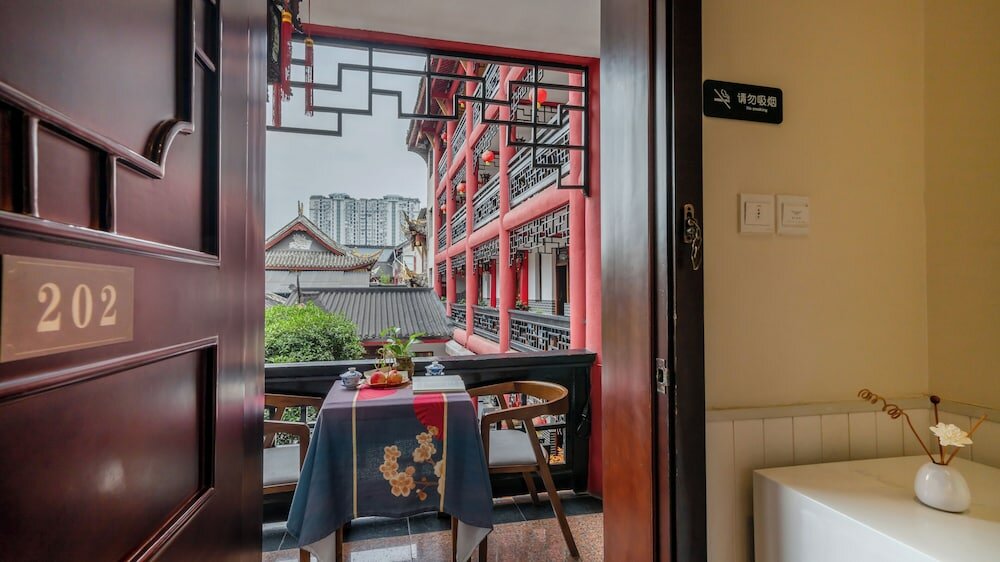 Фото Chengdu Wenjun courtyard Hotel