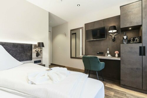 Гостиница Hotel Demas Unterhaching в Унтерхахинге