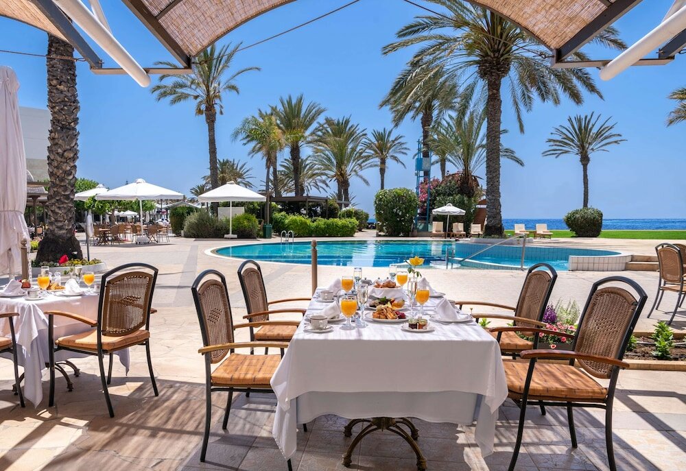Фото Constantinou Bros Athena Beach Hotel