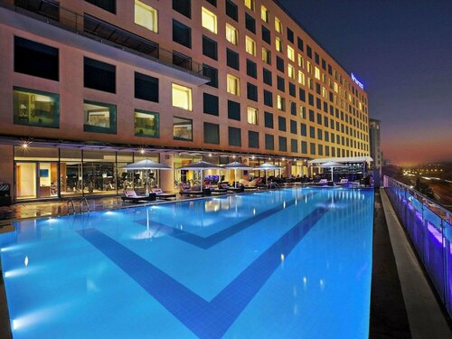 Внешний вид отеля Novotel Pune Viman Nagar Hotel в Пуне, фото 4