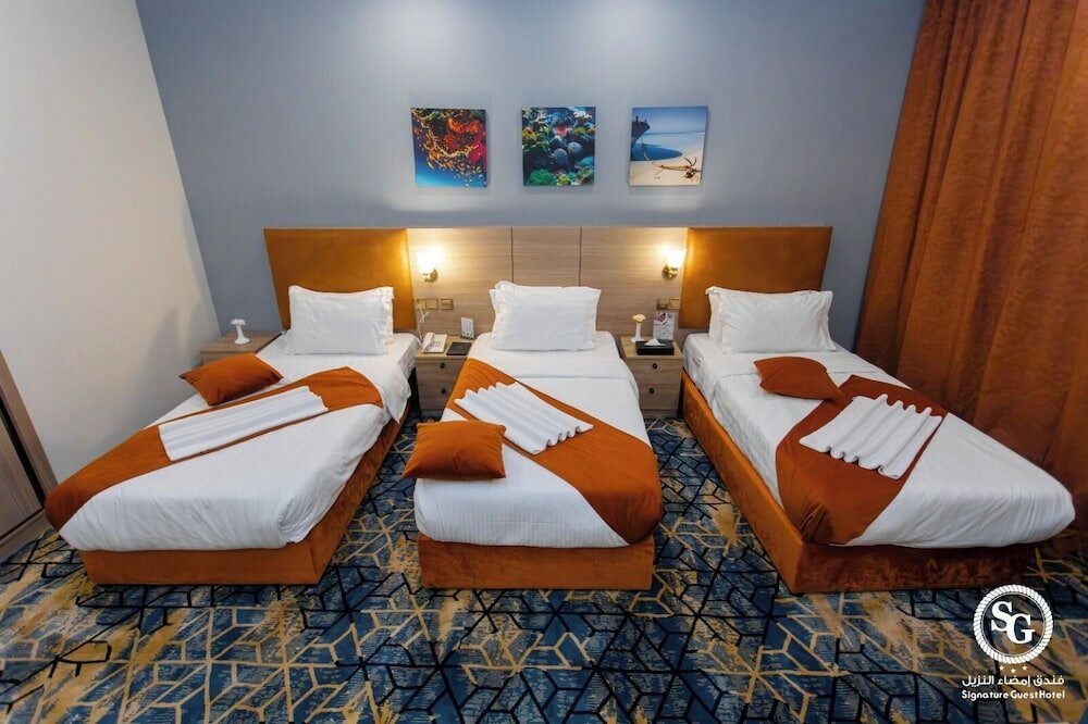 Фото Signature Guest Hotel