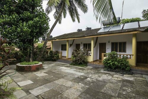 Гостиница Jackies Daynite - A Wandertrails Stay в Вагаторе