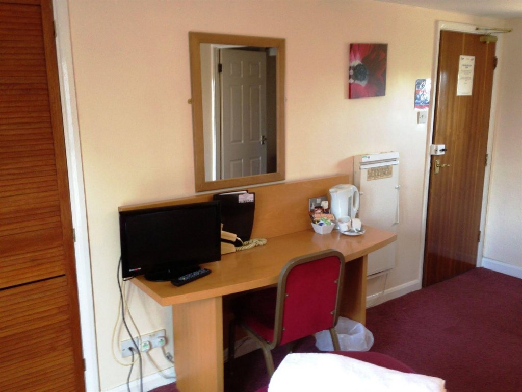 Фото Coach House Hotel