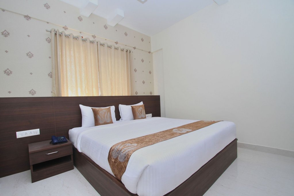 Фото Capital O 9917 Sjr Suites And Comforts