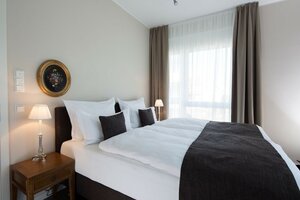 Гостиница Hotel Logis First Class Business Suites