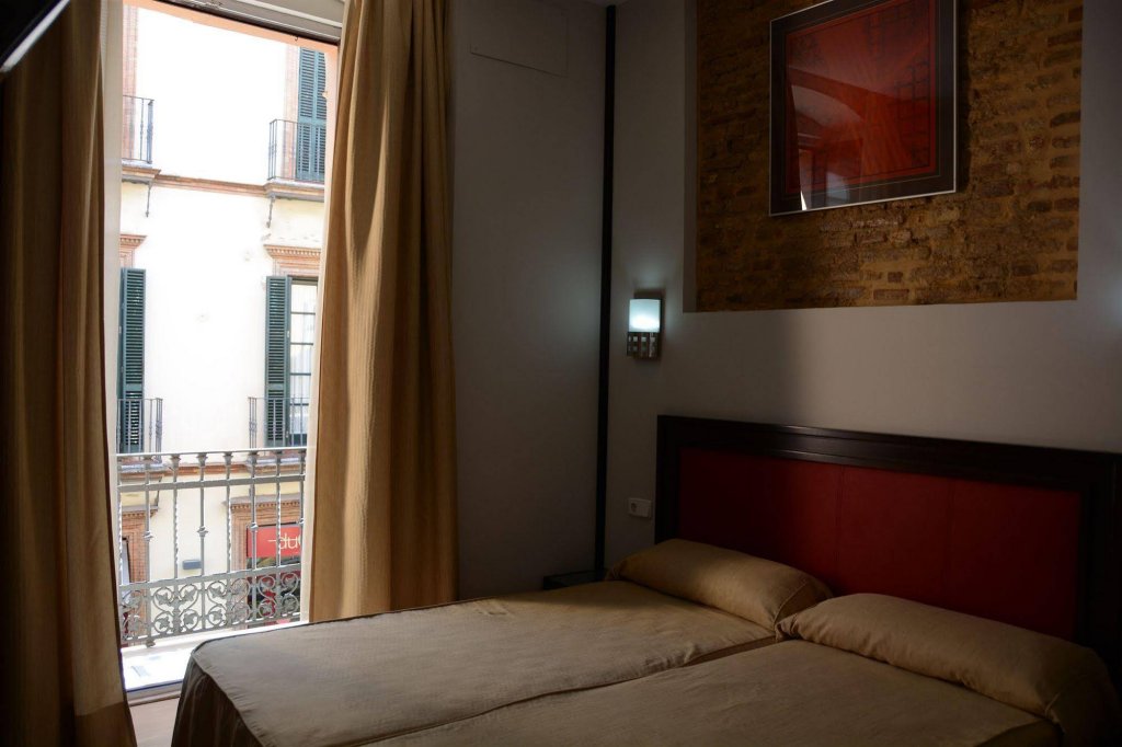 Фото Hotel y Apartamentos Doña Lola