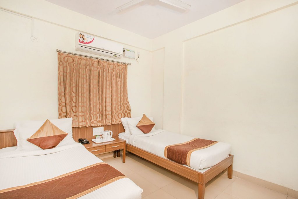 Фото Oyo 7669 The Trinitywood Hotel