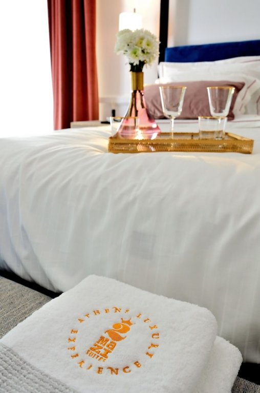Фото 2 Mazi Suites