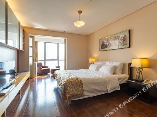 Фото Qingdao Housing International Hotel