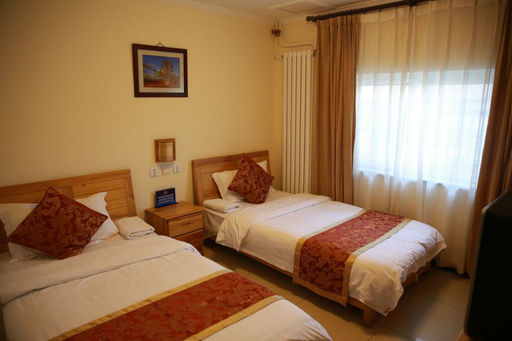 Фото Happy Dragon Saga Hotel (Beijing Tiananmen Wangfujing)