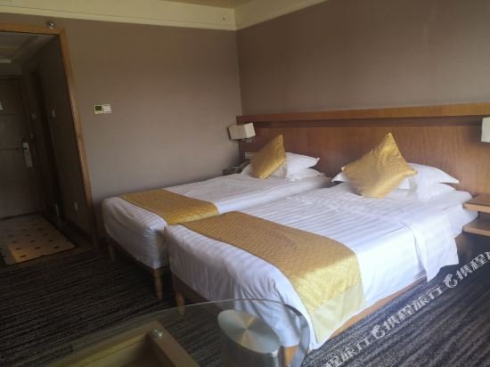 Фото Qingdao Kuaitong International Hotel