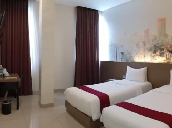 Фото Opi Indah Hotel