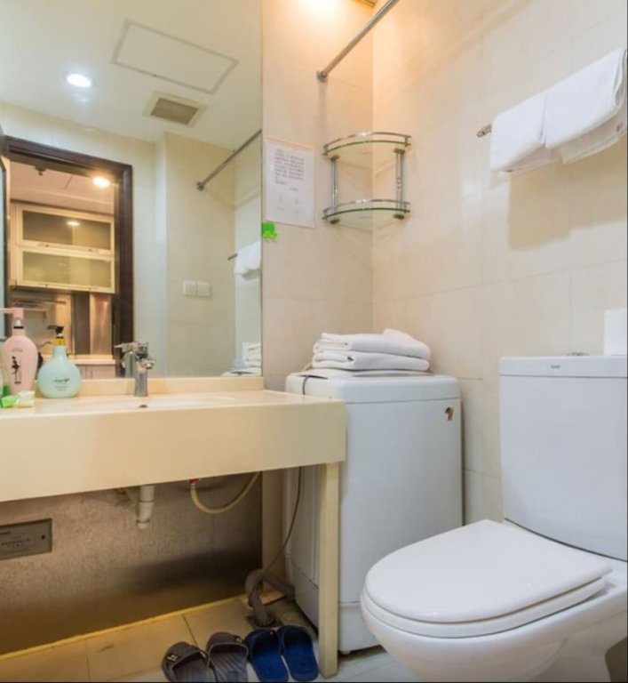 Фото Shanghai Yueyi Apartment Hotel