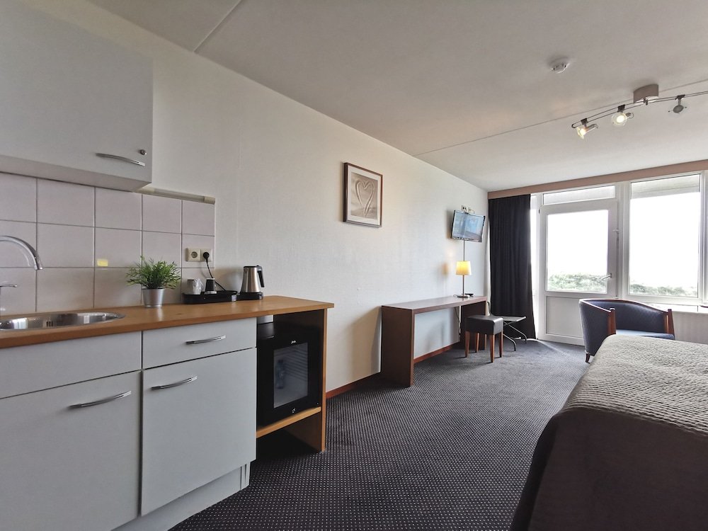 Фото Strandhotel Het Hoge Duin