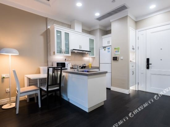 Фото Shanghai Xinchuan Boutique Apartment