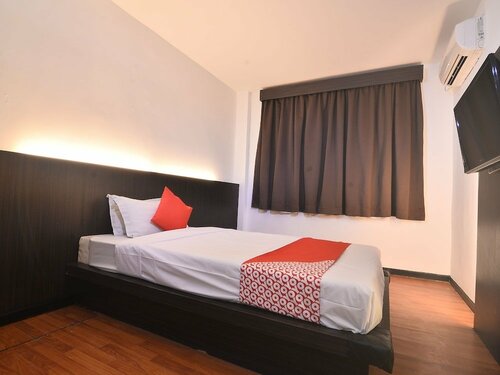Гостиница Oyo 43960 Laksamana Executive & Boutique Hotel в Тавау