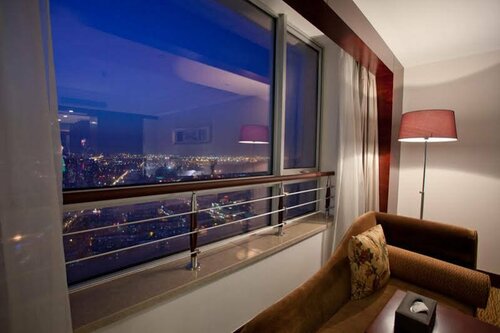 Гостиница Grand New Century Hotel в Циндао