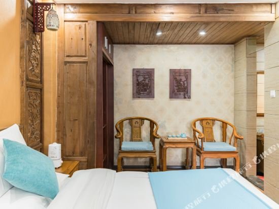 Фото Li Jiang Hemuju Inn