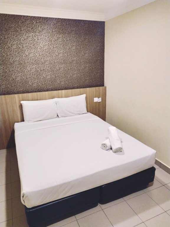 Фото Oyo 615 Dragon Inn Premium Hotel