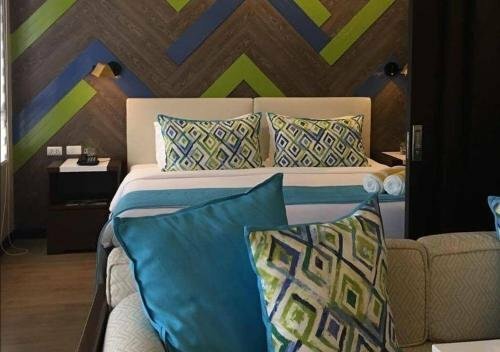 Гостиница The Serviced Residences At Kasa Luntian Managed by в Тагайтае
