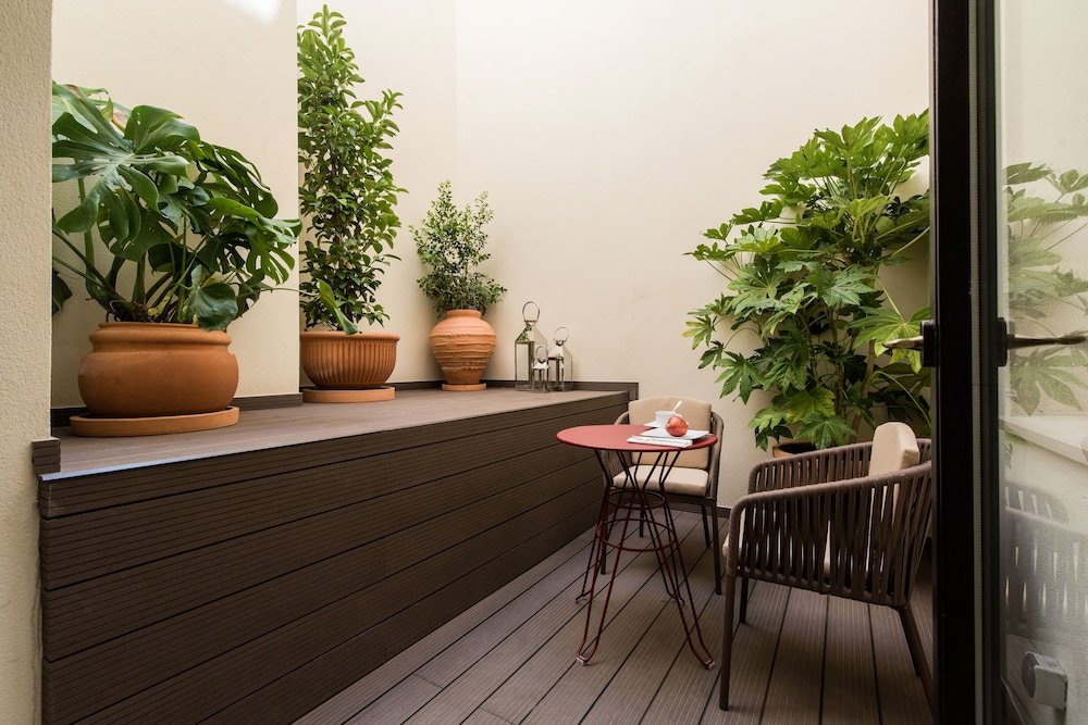 Фото Suites Murillo Plaza Sta Cruz