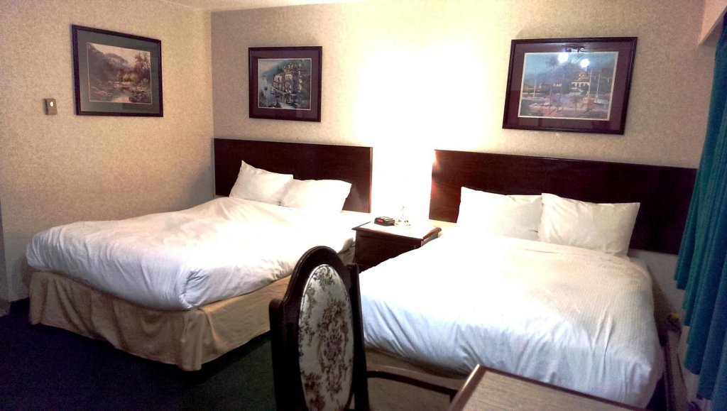 Фото Magnuson Hotel Grace Inn
