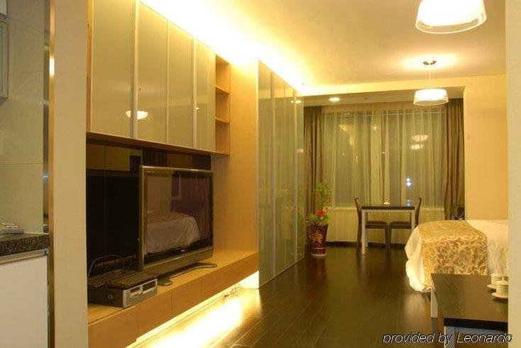 Фото Qingdao Housing International Hotel