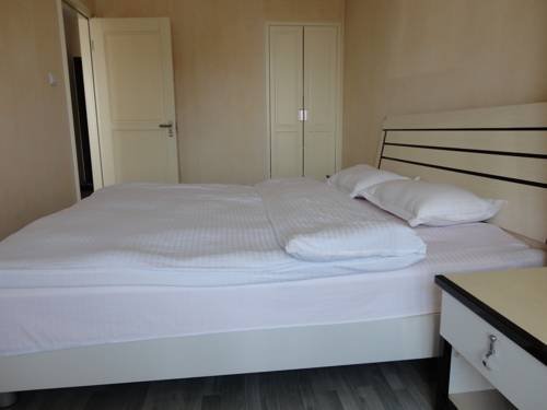 Фото Dalian Xiu Zhu Mansion Apartment