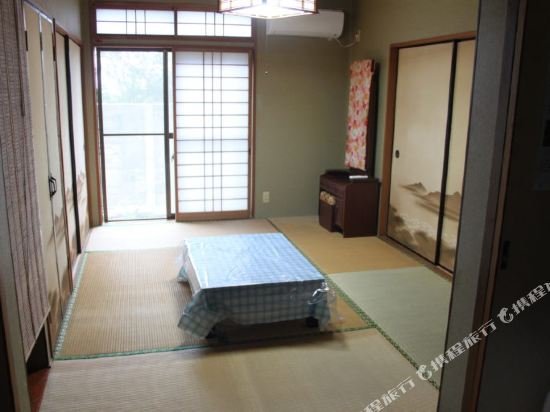 Фото Guesthouse Amami Long Beach