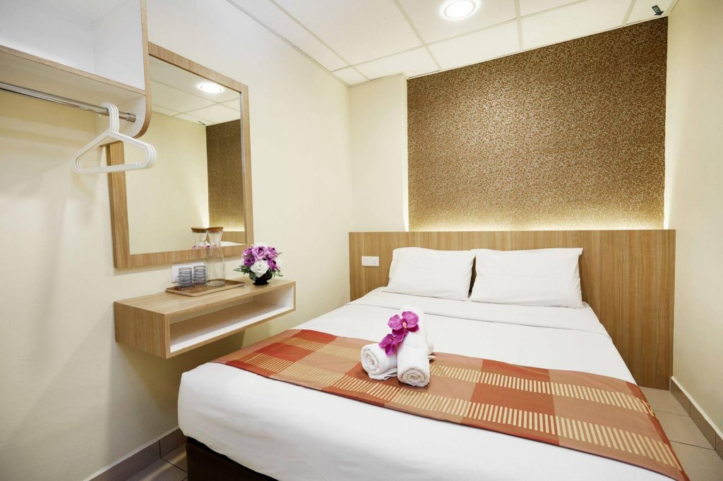 Фото Oyo 615 Dragon Inn Premium Hotel