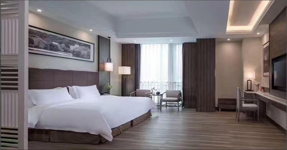 Фото Auden International Hotel