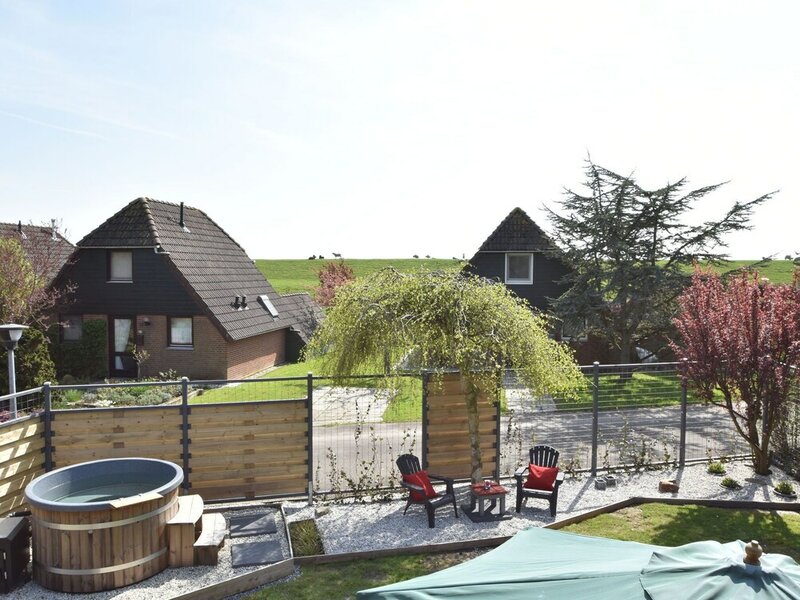 Snug Holiday Home in Herkingen with Hot Tub in Garden
