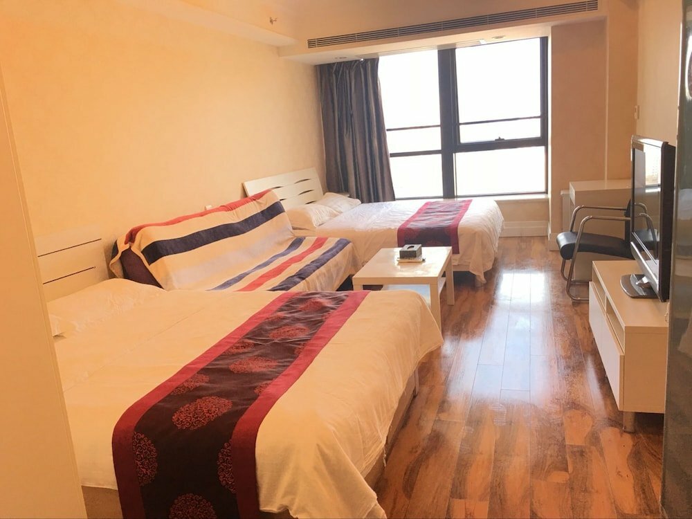 Hotel Huibang Center Apartment, Dalian, photo