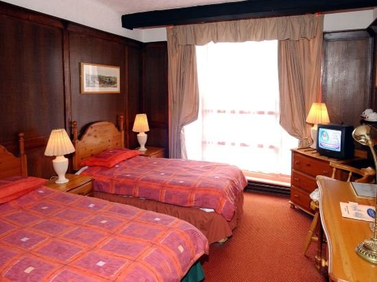 Фото The New Inn by Roomsbooked