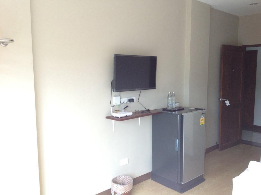 Фото Chompu Nakarin Apartment